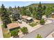 Charming mountain home featuring a wraparound porch, a detached garage, and mature trees at 403 Anderson St, Castle Rock, CO 80104