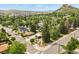 Street view of property with house, garage, and landscaping, surrounded by mature trees at 403 Anderson St, Castle Rock, CO 80104