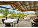 Outdoor covered deck with a ceiling fan, comfortable seating, a dining table, and great views, perfect for relaxing at 403 Anderson St, Castle Rock, CO 80104