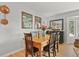 Dining room with hardwood floors, bright natural light, and stylish decor at 403 Anderson St, Castle Rock, CO 80104