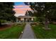 Charming single-story home with a landscaped front yard, walkway, and cozy front porch seating area at 403 Anderson St, Castle Rock, CO 80104
