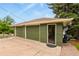 Spacious three-car garage with an open side door, providing ample storage and convenience at 403 Anderson St, Castle Rock, CO 80104
