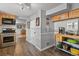 Galley kitchen featuring stainless steel appliances, butcher block counters, and gray wood flooring at 403 Anderson St, Castle Rock, CO 80104