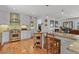 Bright kitchen with hardwood floors, a gas range, and a butcher block island at 403 Anderson St, Castle Rock, CO 80104