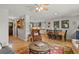 Open-concept living room leading to the dining area and kitchen, featuring hardwood floors, and comfortable seating at 403 Anderson St, Castle Rock, CO 80104