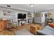 Living Room featuring a rocking chair, TV, and comfortable seating at 403 Anderson St, Castle Rock, CO 80104