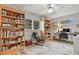 Well-lit home office with built-in bookshelves, a comfortable desk, and large windows, perfect for focused work at 403 Anderson St, Castle Rock, CO 80104