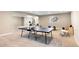 Basement featuring a ping pong table, exercise equipment, and a play area at 22891 E Union Cir, Aurora, CO 80015