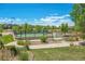 Community basketball court surrounded by green lawns and lush trees, great for outdoor sports at 22891 E Union Cir, Aurora, CO 80015