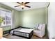Airy bedroom with a window and cozy chair that adds a relaxing touch to the space at 22891 E Union Cir, Aurora, CO 80015