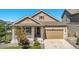 Charming, single-story home with a well-manicured lawn, attached two-car garage, and covered front porch at 22891 E Union Cir, Aurora, CO 80015