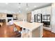 Bright kitchen featuring stainless steel appliances, white cabinets, and a large center island at 22891 E Union Cir, Aurora, CO 80015