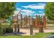 Vibrant community playground featuring a slide, climbing structures, and a soft ground cover at 22891 E Union Cir, Aurora, CO 80015