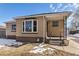 Brick home with a bay window and covered front porch at 2584 S Utica St, Denver, CO 80219