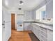 Kitchen with light gray cabinets and laminate countertops at 2584 S Utica St, Denver, CO 80219