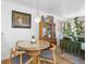 Cozy dining area featuring a modern table, chairs, a stylish light fixture, and nice decor at 1335 Jasmine St, Denver, CO 80220