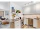 Modern kitchen with stainless steel appliances, sleek countertops, and hardwood floors and lighting at 1335 Jasmine St, Denver, CO 80220
