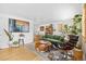 Stylish living room with hardwood floors, modern furniture, and ample natural light and decor at 1335 Jasmine St, Denver, CO 80220