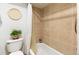Bathroom area featuring a toilet, shower with light tile and sleek modern fixtures at 1833 N Williams St # 201, Denver, CO 80218