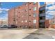 Brick building exterior showing parking and an outside staircase at 1833 N Williams St # 201, Denver, CO 80218