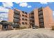 Exterior full view of a red brick apartment building with black metal balconies at 1833 N Williams St # 201, Denver, CO 80218