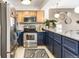 Updated kitchen with two tone cabinets, stainless steel appliances, and stone countertops at 1833 N Williams St # 201, Denver, CO 80218