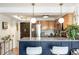 Updated kitchen with two tone cabinets, stainless steel appliances, and bar seating at 1833 N Williams St # 201, Denver, CO 80218