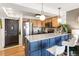 Updated kitchen with two tone cabinets, stainless steel appliances, and bar seating at 1833 N Williams St # 201, Denver, CO 80218
