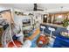 Open-concept living area with modern furnishings, including a stylish swing chair and breakfast bar at 1833 N Williams St # 201, Denver, CO 80218