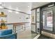 Apartment lobby with clean white walls and a view to the outdoors at 1833 N Williams St # 201, Denver, CO 80218