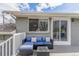 Charming back deck featuring comfortable seating, perfect for enjoying sunny days and outdoor living at 3841 W Quinn Pl, Denver, CO 80236