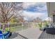 Inviting back deck with outdoor seating, perfect for relaxation and enjoying the serene surroundings at 3841 W Quinn Pl, Denver, CO 80236