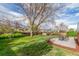 Beautiful backyard with a manicured lawn, privacy fence, and a concrete patio for outdoor enjoyment at 3841 W Quinn Pl, Denver, CO 80236