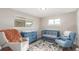 Inviting Bedroom with blue furniture, playful rug, and cozy seating at 3841 W Quinn Pl, Denver, CO 80236