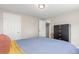 Bedroom with wood floors, a large closet, and a dresser at 3841 W Quinn Pl, Denver, CO 80236