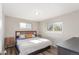 Bright bedroom with wood floors, natural light, and neutral wall color at 3841 W Quinn Pl, Denver, CO 80236