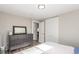 Bedroom with gray dresser, wood floors, and large closet at 3841 W Quinn Pl, Denver, CO 80236