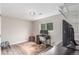 Bright bedroom with a desk, large window, and organized shelving offering functionality and comfort at 3841 W Quinn Pl, Denver, CO 80236