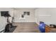 Bright exercise room featuring modern equipment and a minimalist aesthetic, perfect for a home gym at 3841 W Quinn Pl, Denver, CO 80236