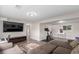 Spacious living room with neutral paint, wood floors and large sectional sofa at 3841 W Quinn Pl, Denver, CO 80236