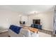 Inviting living room featuring an open layout, hardwood floors, and a cozy seating area with modern fixtures at 3841 W Quinn Pl, Denver, CO 80236