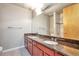Bathroom featuring a double vanity with granite countertop and large mirror with a shower in view at 1475 Delgany St # 807, Denver, CO 80202