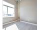 Modern bedroom with big window, grey walls, and wood-look flooring at 1475 Delgany St # 807, Denver, CO 80202