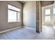 Bedroom with a large window, wood-look flooring, and modern lighting and great natural light at 1475 Delgany St # 807, Denver, CO 80202