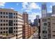 A stunning city view featuring towering skyscrapers, residential buildings, and clear blue skies at 1475 Delgany St # 807, Denver, CO 80202