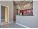 Kitchen with stainless steel appliances, concrete ceiling, pendant lights, and light grey floors at 1475 Delgany St # 807, Denver, CO 80202