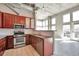 Modern kitchen features stainless steel appliances, tile backsplash, and dark wood cabinetry at 1475 Delgany St # 807, Denver, CO 80202