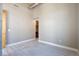 Open living space with light grey tile flooring and view of open kitchen area at 1475 Delgany St # 807, Denver, CO 80202