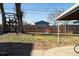 Spacious backyard with a large tree, swing set and colorful slide at 5103 Quitman St, Denver, CO 80212