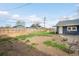 Expansive backyard featuring grass, a wood fence and outdoor seating at 5103 Quitman St, Denver, CO 80212